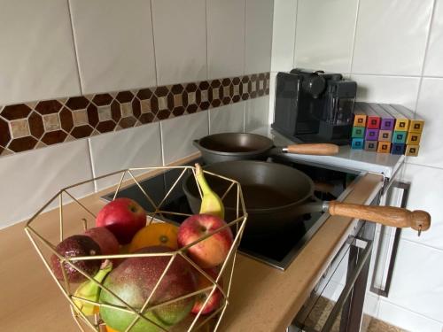 a bowl of fruit on a counter in a kitchen at Tolle Ferienwohnung in Vorderthiersee mit Grill, Garten und Terrasse in Thiersee