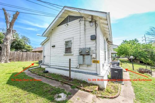 a small white house with a yard at New Gathering Place on Columbus in Waco