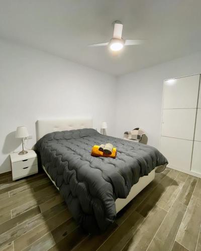 a bedroom with a bed with a yellow object on it at Casa Rural Sarsalet in Chella