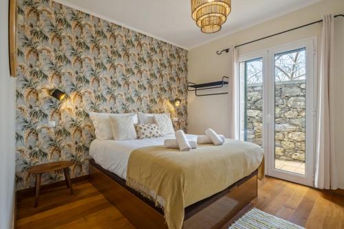 Postel nebo postele na pokoji v ubytování Casas do Salao by Homie