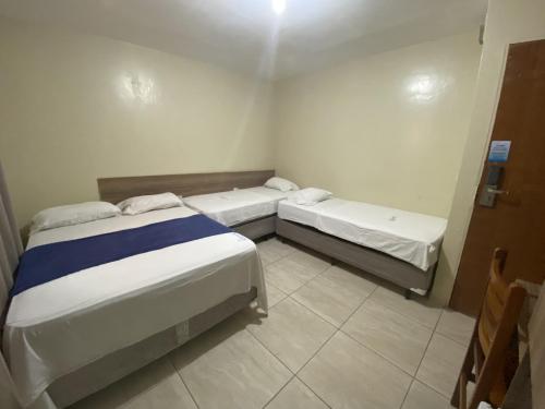 Hotel Pousada dos Anjosにあるベッド