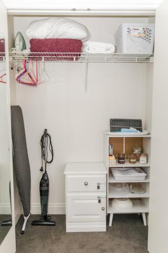 a bedroom with a bunk bed and a desk at A City Stay Holiday on Queen Street in Auckland