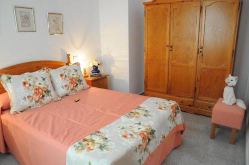 Tempat tidur dalam kamar di Helles Appartement in Vecindario