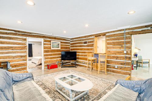 a living room with a wooden wall at Home with Fireplace Less Than 1 Mi to Peninsula State Park! in Fish Creek