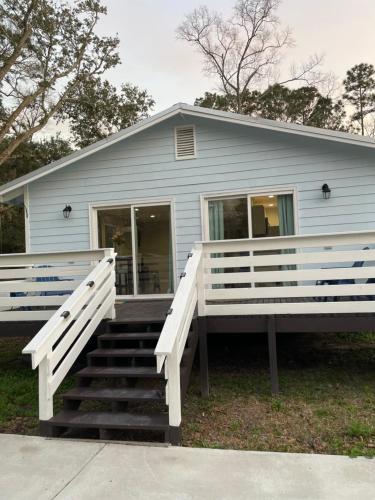a house with a staircase leading up to a house at Ocean Springs Cottage 2 Bedroom 2 Bath in Ocean Springs