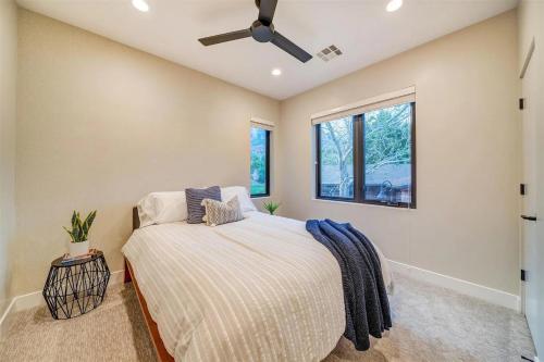 a bedroom with a bed and a ceiling fan at LaFave Luxury Rentals at Zion in Springdale