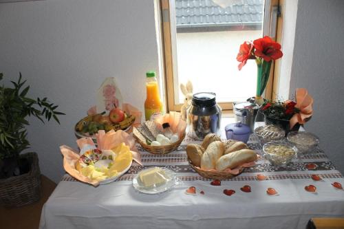 a table with baskets of food on top of it at Tolles Appartement in Hanau in Hanau am Main
