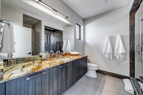 a bathroom with a sink and a toilet at LaFave Luxury Rentals at Zion in Springdale