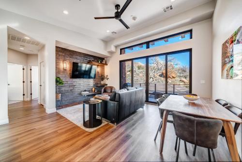 a dining room and living room with a table and chairs at LaFave Luxury Rentals at Zion in Springdale