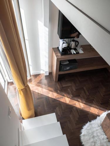a living room with a television and a wooden floor at Terra Mia in Piazza in Pompei