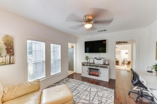 a living room with a couch and a tv at 1 Mi to Dtwn Waco! Lovely Home with Fire Pit Table in Waco