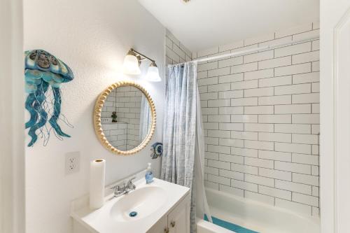 a bathroom with a sink and a mirror at Lovely Waco Retreat with Yard and Patio 2 Mi to Dtwn! in Waco