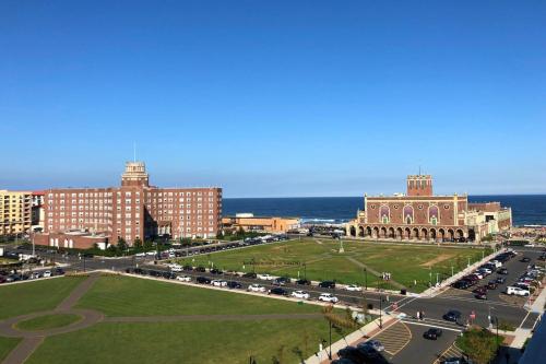 a city with cars parked in a parking lot at Berkeley Oceanfront Hotel in Asbury Park