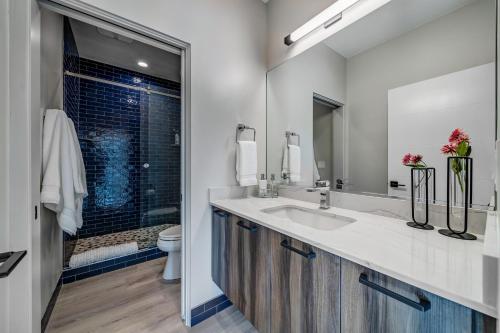 a bathroom with a double sink and a shower at LaFave Luxury Rentals at Zion in Springdale