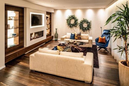 Zona d'estar a Luxuriöses Panorama Chalet Penthouse mit Sauna und Hot-Whirpool