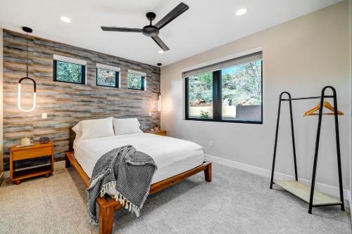 a bedroom with a bed and a wooden wall at LaFave Luxury Rentals at Zion in Springdale