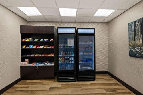 a store with two refrigerators in a room at Comfort Inn & Suites Newcastle - Oklahoma City in Newcastle