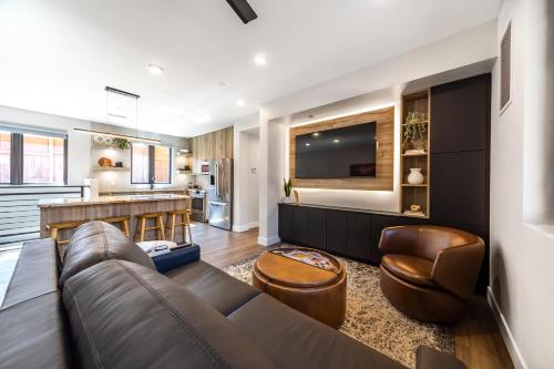 a living room with a couch and a kitchen at LaFave Luxury Rentals at Zion in Springdale