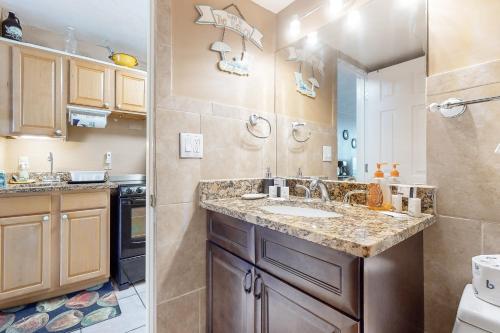a bathroom with a sink and a counter top at Harbour Beach Resort Unit 808 in Daytona Beach