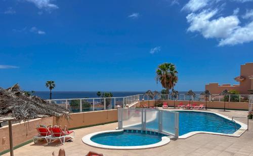 a swimming pool with a view of the ocean at Paz Ocean View, Air condition, Wifi, Heated pool in San Miguel de Abona