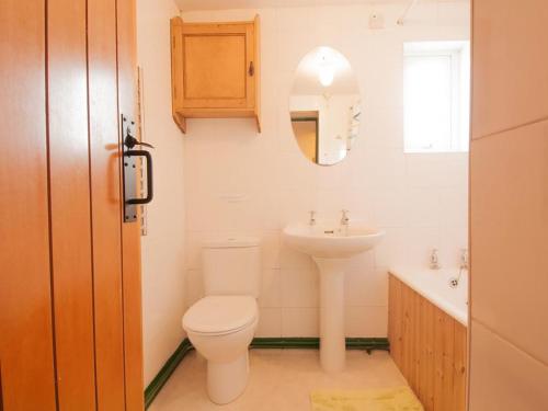 a bathroom with a toilet and a sink at 2 Bed in Wasdale SZ580 in Santon Bridge