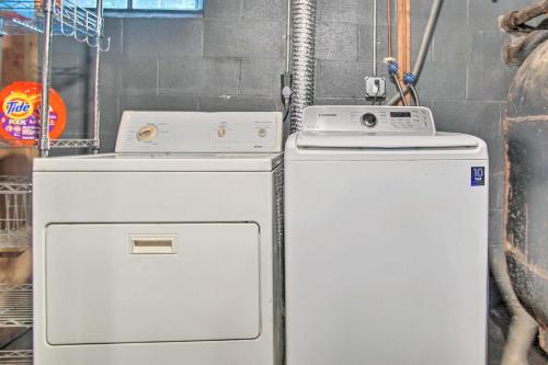 two washing machines sitting next to each other at Buttermilk Cottage in Cape Cod Steps to Beach in Wareham