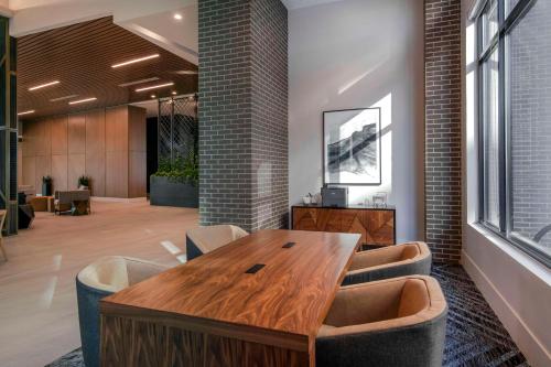 a conference room with a wooden table and chairs at Embassy Suites By Hilton Asheville Downtown in Asheville