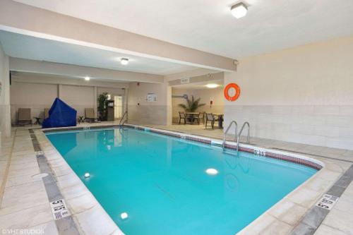 a large swimming pool in a hotel room at Quality Inn & Suites in Morgantown