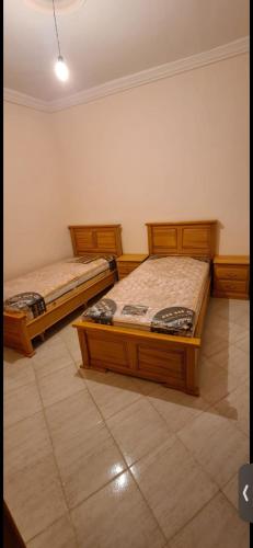 Tempat tidur dalam kamar di Appartement Bni Bouayach