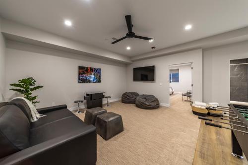 a living room with a couch and a tv at LaFave Luxury Rentals at Zion in Springdale