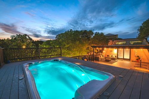 a swimming pool on the deck of a house at Breathtaking Roof Pool Views, Gameroom, Firepit in San Antonio