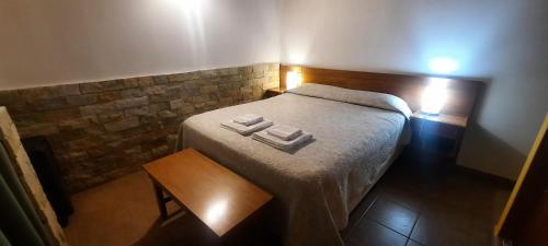 Postel nebo postele na pokoji v ubytování Ramayon Centro