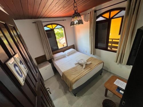 Una cama o camas en una habitación de Pousada Uba-Rio Porto de Galinhas