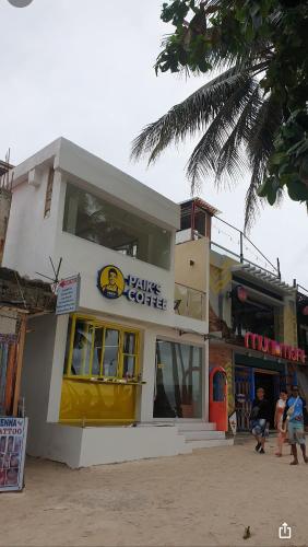 a building with people standing outside of it at Sunvilla beachfront hotel in Boracay