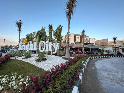a sign that says palm city on a street at Mirage residence resort in Cairo