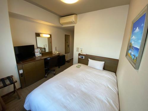 Ένα ή περισσότερα κρεβάτια σε δωμάτιο στο Hotel Route-Inn Hanamaki