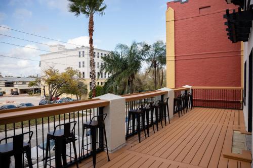 a balcony with tables and chairs on a building at The 1888 Hotel in St Petersburg