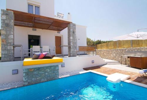 a villa with a swimming pool and a house at Villa Alexandra - Komfort mit eigenem Pool in Loutra