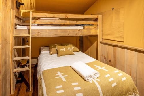 a bedroom with two bunk beds and a ladder at BIG4 Apollo Bay Pisces Holiday Park in Apollo Bay