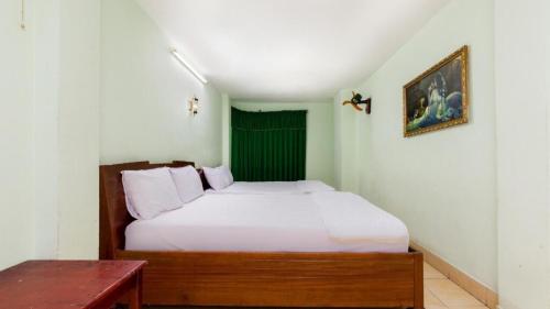 Ένα ή περισσότερα κρεβάτια σε δωμάτιο στο Mặt Trời Vàng Hotel