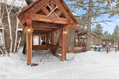 a wooden gazebo in the snow at Gold Rush Lodge in Lead