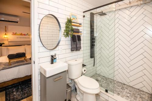 a bathroom with a toilet and a sink at The 1888 Hotel in St Petersburg