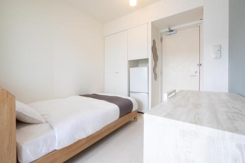 Un pat sau paturi într-o cameră la E-horizon Resort Condominium Sesoko - Vacation STAY 92900v