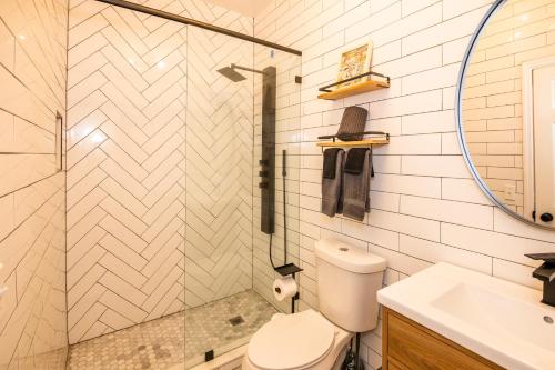 a bathroom with a toilet and a sink at The 1888 Hotel in St Petersburg