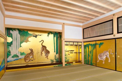a room with a mural of cats on the walls at Hilton Nagoya Hotel in Nagoya
