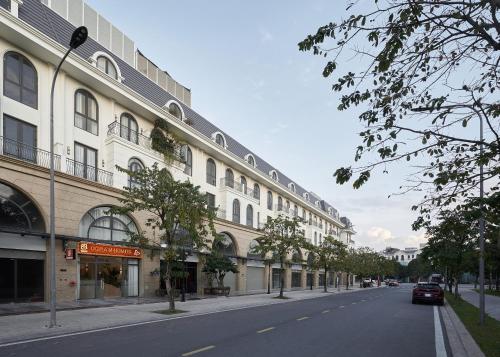 a street with a building on the side of a road at Oceanhomes in Bien Ho