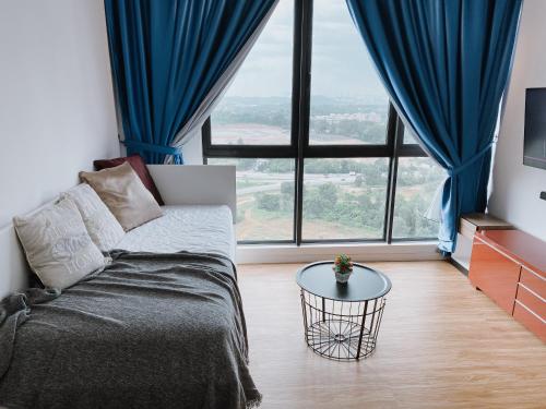 a living room with a couch and a table at Modern 7-Pax Retreat Steps from IOI City Mall in Serdang