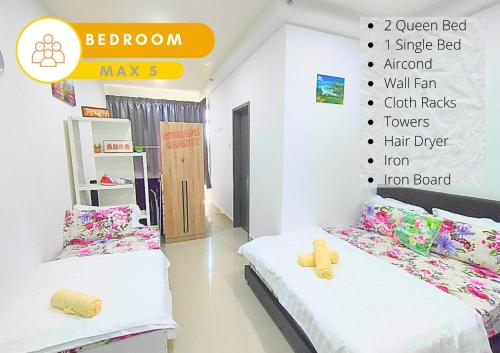 a bedroom with two beds and a wall with a chart at Cozy Stay at Shaftsburry, Urban Convenience #SH1 in Cyberjaya