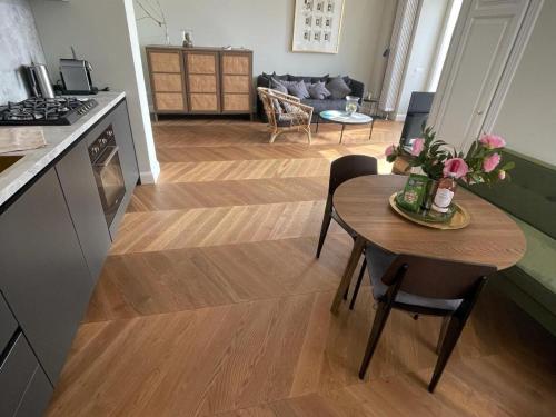 a kitchen and living room with a table with flowers on it at Apartment in Vignone Villa Setting in Vignone