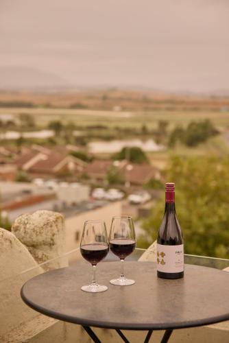 two glasses of red wine sitting on a table at Yarra Valley Grand in Yarra Glen